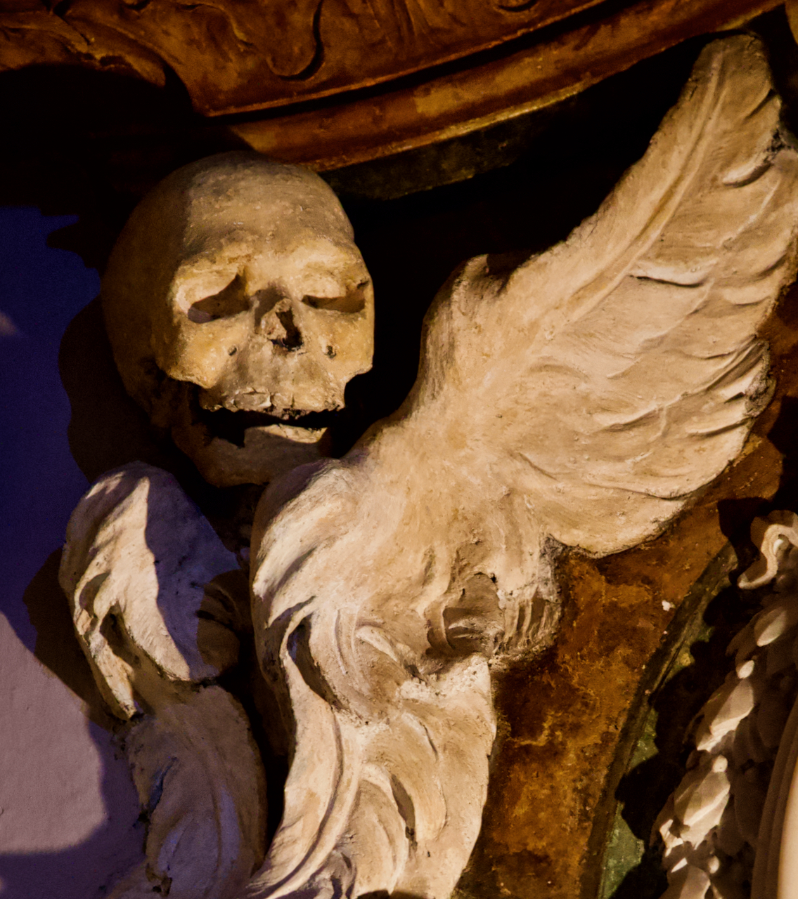 A skull with angel wings at a church in Italy.