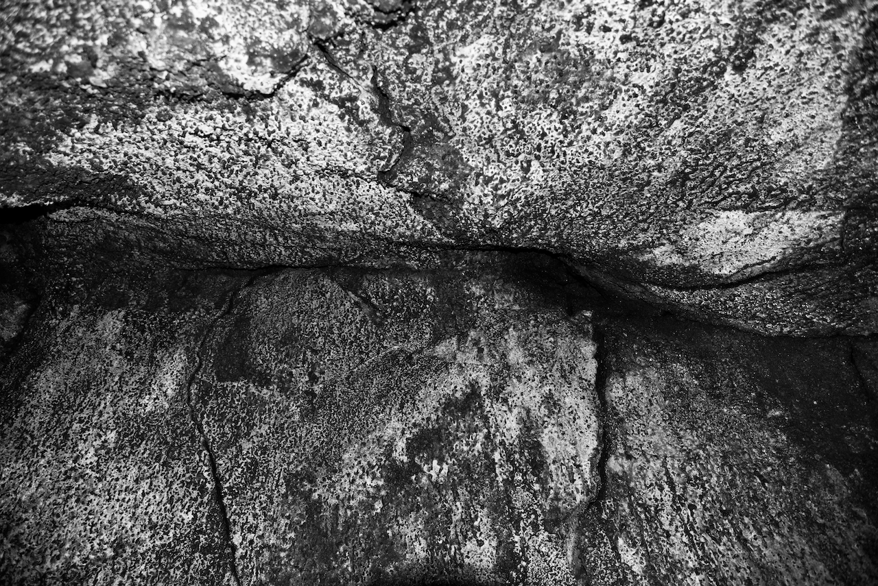 Inside a lava tube in Hawaii, the rock formations are interesting.