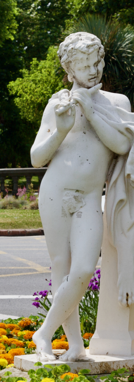 Statue of a boy playing a flute in San Sebastian, Spain.