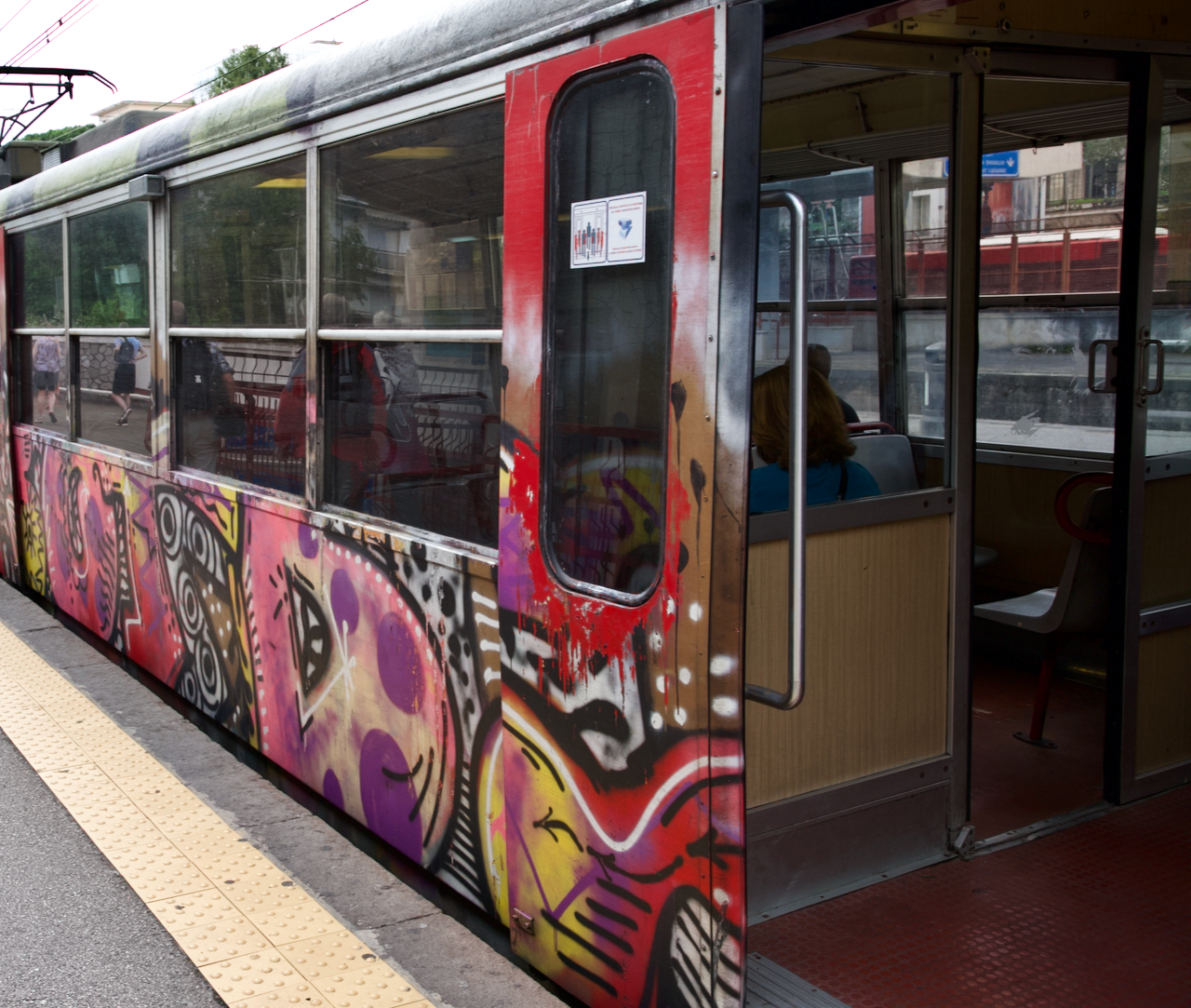 A train car in Europe covered in graffiti.